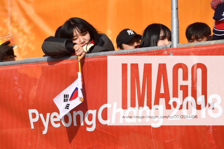 Female fan supporter with Korean flag is tired and bored FIBT men s bobsleigh two man Bob Olympic sliding centre on 18 02 2018 Winter Olympics 2018 from 09 02 25 02 2018 in PyeongChang of South Korea