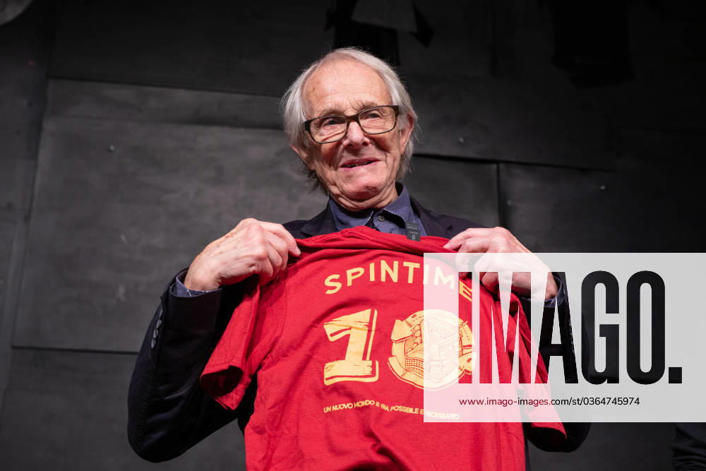 Italy: Ken Loach meets people at Spin Time in Rome Director Ken Loach shows the Spin Time t-shirt during the meeting with the public in Rome Rome RM Italy