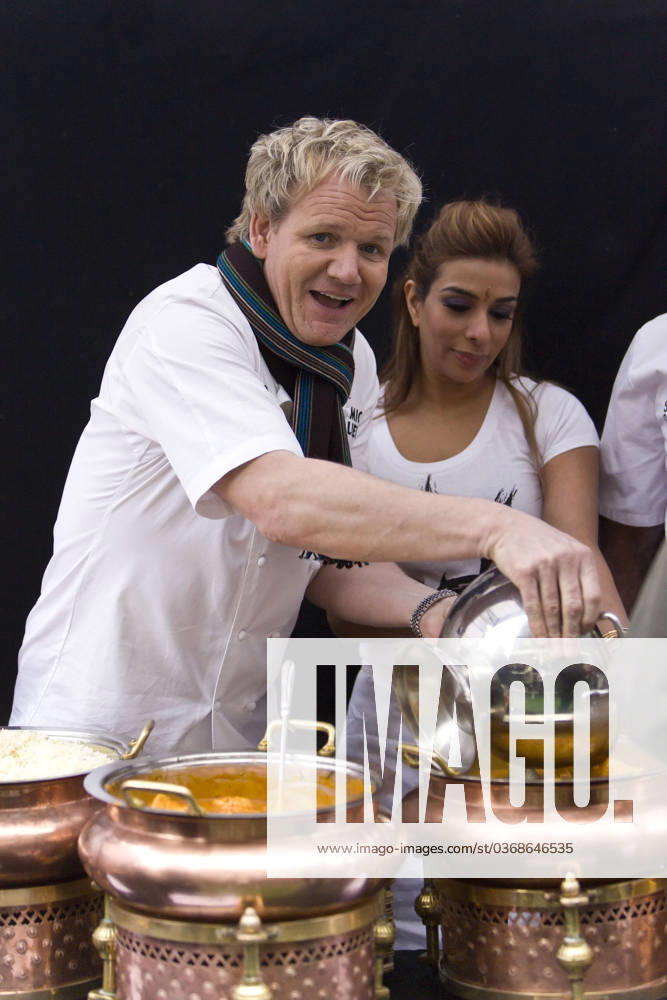 Gourmet king Gordon Ramsay cooks up a curry, with the help of Coronation Street actress Shobna Gulati, on a pop-up stall in London in aid of Comic Relief 50815, LONDON, UNITED KINGDOM -Friday February 4 2011. Gourmet king Gordon Ramsay cooks up a curry with the help of Coronation Street actress Shobna Gulati on his pop-up stall in Brick Lane in aid of Red Nose Day. The TV Chef is working with Comic Relief on a range of their Seriously Good Indian sauces where Comic Relief get at least 10p from the sale of each jar. VIDEO AVAILABLE Photograph: Ringo, PacificCoastNews.com UK OFFICE:+44 131 557 7760 7761 US OFFICE:1 310 261 967