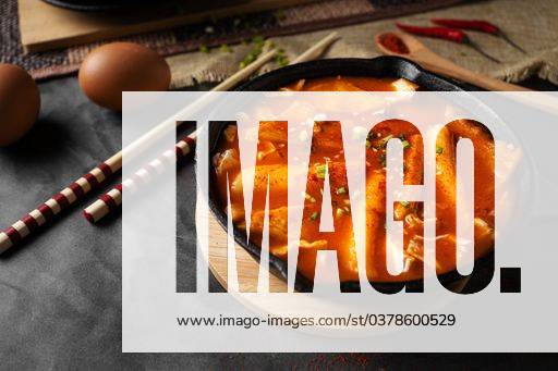 A horizontal shot of a soup in black bowl and some eggs and wooden chopsticks 380053 RECORD DATE NOT STATED