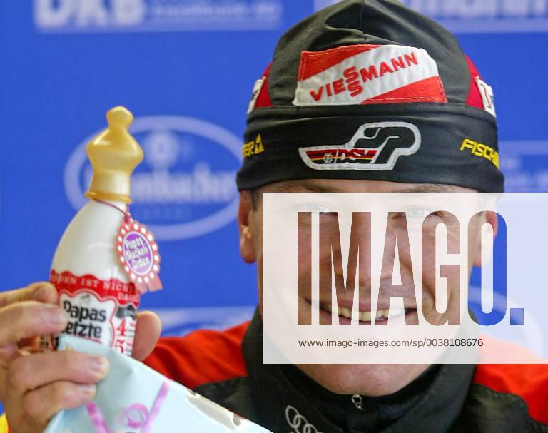 Sven Fischer shows a baby bottle during a press conference at the Biathlon World Championships in Oberhof on Monday 9 Feb 2004 The biathlete became father of a daughter on Sunday evening 8 Feb 2004 Eckehard Schulz Sven Fischer from Germany presents a baby bottle during a press conference at the Biathlon World Championships in Oberhof eastern Germany Monday Feb 9 2004 Fischer s daughter was born Sunday evening Feb 8 2004 Eckehard Schulz OBERHOF DEU