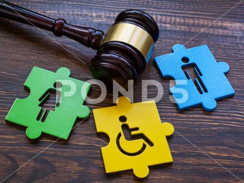 Gavel with puzzle pieces. Disabled person sign as a symbol of inclusion. inclusion equality rights law social diversity discrimination disability integration concept tolerance disabled inequality problem difficulty employment opportunity unfair employee community inclusive unity equity individuality opportunities fairness