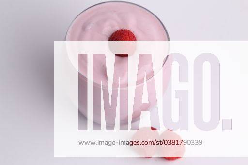 A high angle shot of an organic yogurt smoothie with raspberries on white background 713416 RECORD DATE NOT STATED