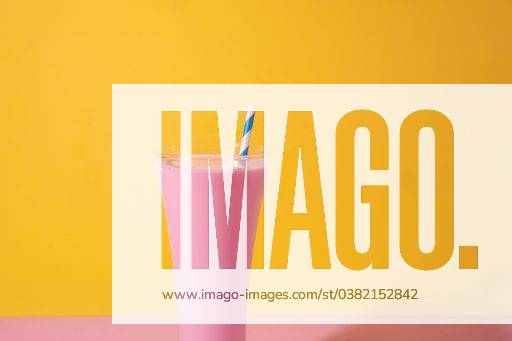 A glass of strawberry smoothie isolated on yellow and pink background 1043358 RECORD DATE NOT STATED