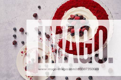 A top view of red velvet cake with raspberries, blueberries, and blackberries 2047745