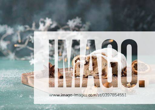 Christstollen, traditonal christmas cake with nuts, raisons, marzipan on a blue background, empty space for text 2773503 RECORD DATE NOT STATED