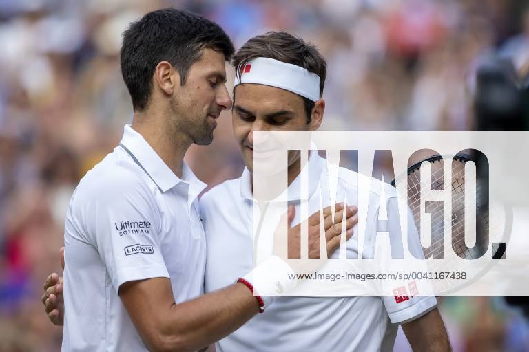 14th July 2019, The All England Lawn Tennis and Croquet Club, Wimbledon, England, Wimbledon Tennis Tournament, Day 13, mens singles final; Novak Djokovic (SER) speaks with Roger Federer (SUI) after he wins the match in a tie break of 5th set ActionPlus12154031 ShaunxBrooks