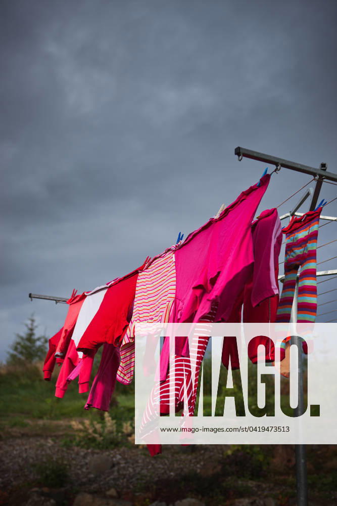 Pink clothes on washing line Iceland, Borgarbyggð, Reykholt R_EZDKCL240228I-1345903-01 ,property released