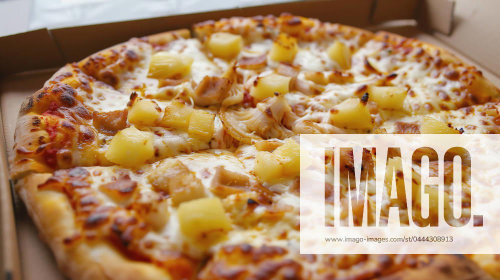 Close-up image of a freshly baked Hawaiian pizza with pineapple and ham toppings, served in a brown cardboard delivery box. Generative AI image Model Released RamonLopez_ID20831_614430_004