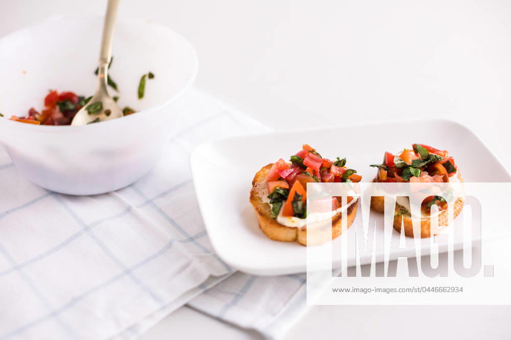 Cheese tomato basil bruschetta on plate Coeur d Alene, Idaho, United States R_PXQG240416E6-1402816-01