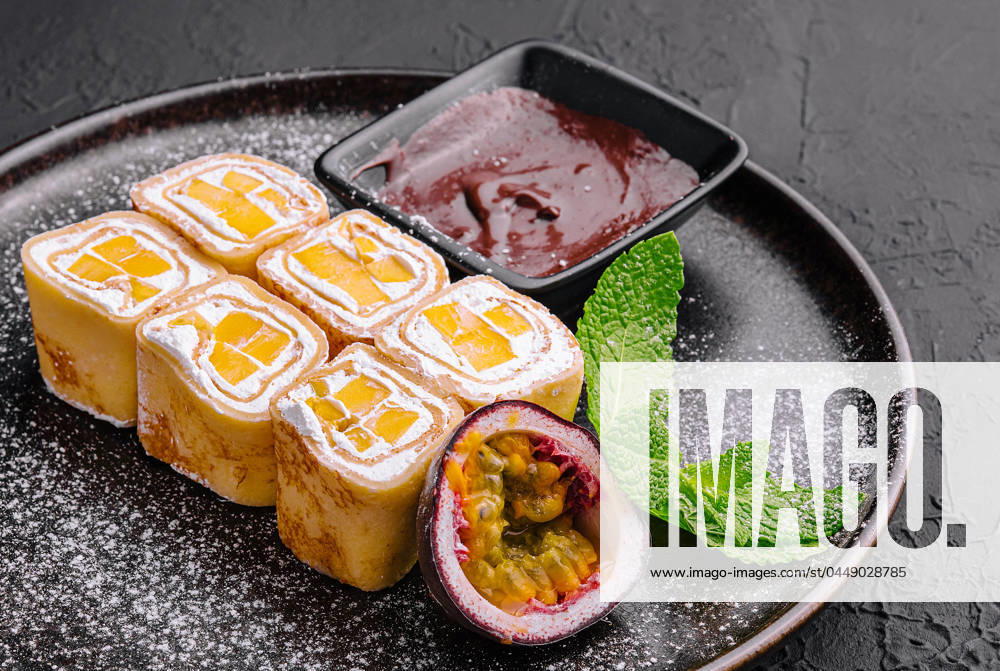 Delicious fruit sushi rolls in pancake with cottage cheese Delicious fruit sushi rolls in pancake with cottage cheese