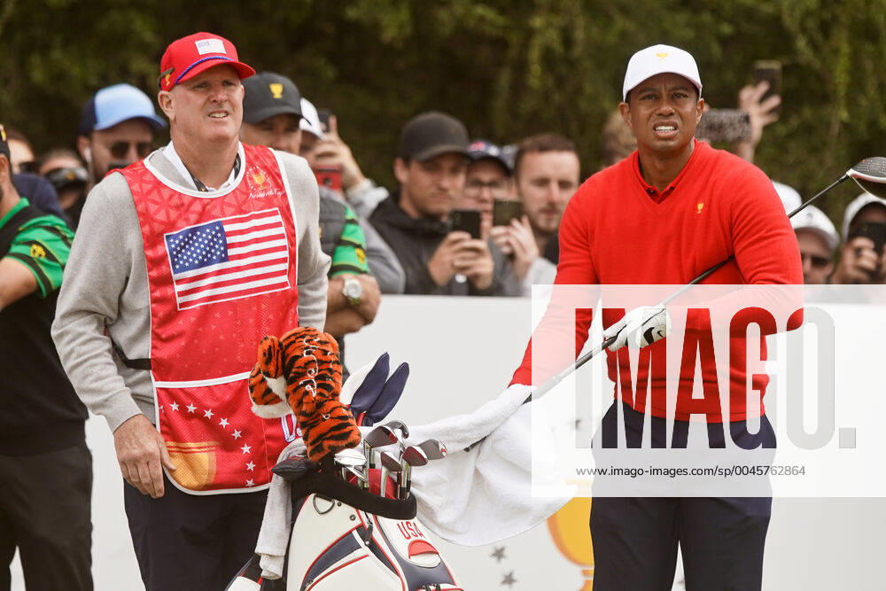 Victoria, Melbourne, Australila: Tiger Woods (R) and caddie Joe LaCava wait on the second tee during the final round of the 2019 Presidents Cup at The Royal Melbourne Golf Club. Golf 2019: 2019 Presidents Cup: Final Round - ZUMAw109 20191214_zap_w109_108