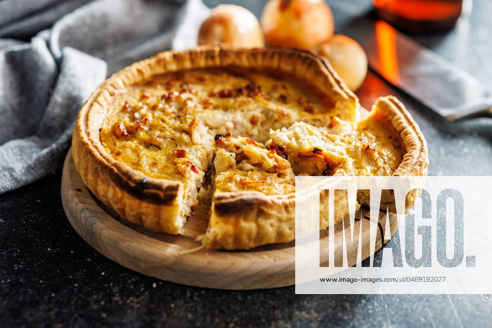 Traditional french pie. Quiche lorraine on kitchen table. Traditional french pie. Quiche lorraine on the kitchen table.