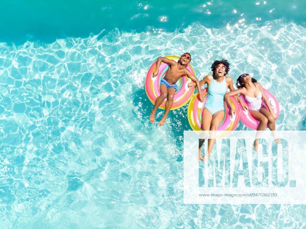 Diverse family enjoy a pool day, with copy space Diverse family enjoy a pool day, with copy space. They float on colorful rings, capturing the essence of summer fun., model released, , property released, Cape Town, South Africa, 15.11.2023, 4920527.jpg, people,diverse,family,pool day,copy space,float,colorful rings,summer,fun,pool,swimming,relaxation,leisure,water,enjoyment,splashing,outdoors,happiness,joyful,activity,recreation,lifestyle,together,bonding,unity,diversity,inflatable,rings,floating,refreshing,sunlight,sunny,cheerful,vibrant,colorful,leisurely,sunny day,summer fun,poolside,activities,outdoor,aquatic,family time,sunny weather,water fun,summer activities,carefree,smiling,having fun Child,Boy,Male,Black,Girl,Female,Multiracial,Y