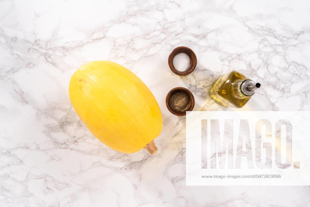 Spaghetti squash Preparing organic spaghetti squash with olive oil, salt, and pepper.
