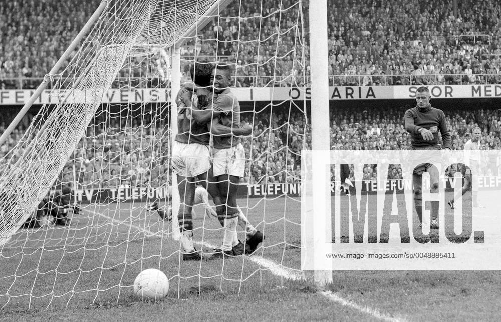 STOCKHOLM 1958 06 29 Brazils Vava L is hugged Pele after scoring the 2 1 goal to take the lead in the FIFA World Cup final soccer match at Rasunda stadium in Stockholm, Sweden In the background Sweden s goalkeeper Kalle Svensson and Sigge Parling Brazil won 5 2 and became World Champions for the first time, Stockholm Sweden SOCCER