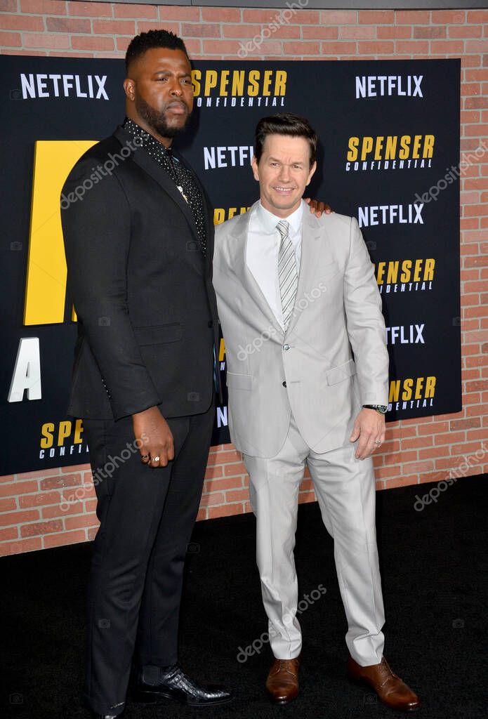 LOS ANGELES, CA: 27, 2020: Winston Duke & Mark Wahlberg at the world premiere of Spenser Confidential at the Regency Village Theatre