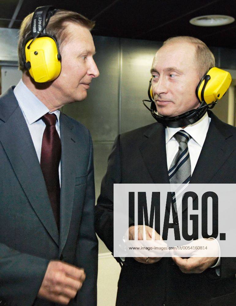 ITAR-TASS 84: MOSCOW, RUSSIA. NOVEMBER 8. Russian Defence Minister Sergei Ivanov and Russian President Vladimir Putin, L-R, wear ear defenders on a visit to a new headquarters of the Main Intelligence Agency (GRU) of the Russian Armed Forces General Staff. 379648