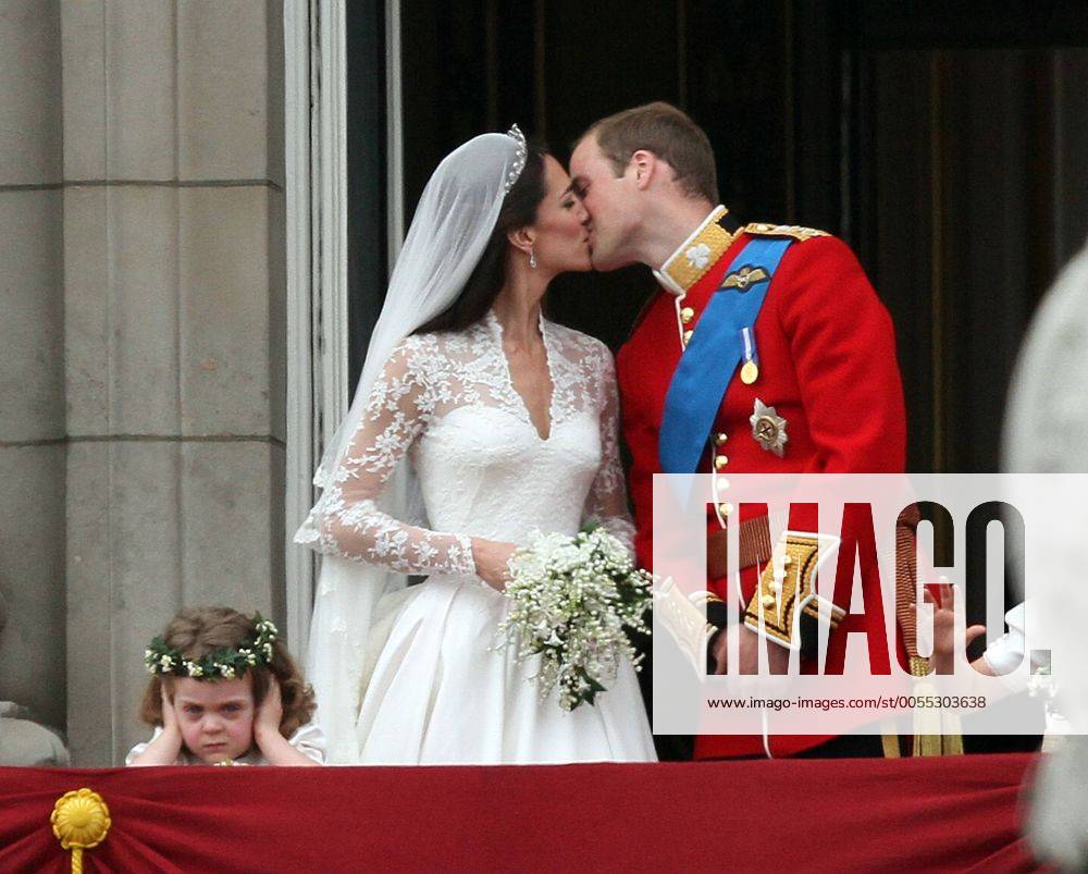 . . Royal Wedding Prince William of Wales and Catherine Kate Middleton . . 29.04.11 Prince William Duke of Cambridge, Catherine Duchess of Cambridge kiss on the balcony of Buckingham Palace as bridesmaid Grace van Cutsem covers her ears. The Royal Wedding takes place today of Prince William and Kate Middleton at Westminster Abbey, London.