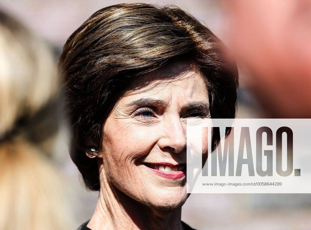 Oct. 27, 2012 - Dallas, Texas, U.S. - Former First Lady LAURA BUSH participates in the pre game coin toss before the game between the Memphis Tigers and the Southern Methodist Mustangs at the Gerald J. Ford Stadium in Dallas, Texas. SMU defeats Memphis 44 to 13. Dallas U.S. - ZUMAw30