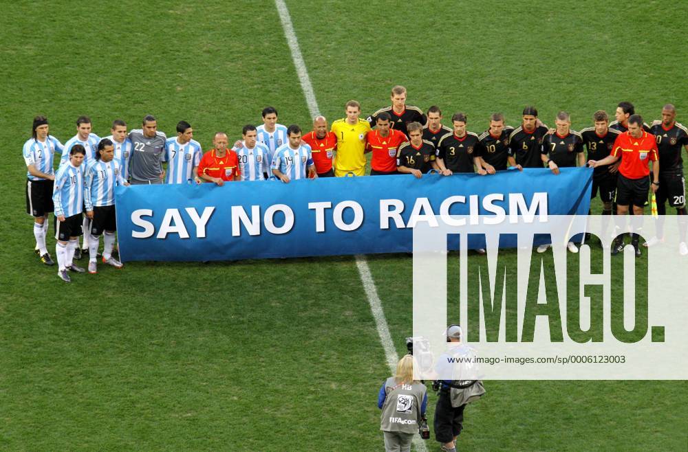 Players of Argentina and Germany pose together with a banner which reads say no to racism prior to their 2010 World Cup quarterfinal soccer match at Green Point stadium in Cape Town on July 3, 2010. From left: Martin Demichelis, Lionel Messi, Gonzalo Higuain, Carlos Tevez, Nicolas Otamendi, Sergio Romero, Angel di Maria, Linesman Bakhadyr KOCHKAROV (KGZ), Maxi Rodriguez, Nicolas Burdisso, Javier Mascherano, 4. Official Jerome DAMON (RSA), Manuel Neuer, Referee Ravshan IRMATOV (UZB), Per Mertesacker, Philipp Lahm, Miroslav Klose, Arne Friedrich, Lukas Podolski, Sami Khedira, Bastian Schweinsteiger, Thomas Müller, Mesut Özil, Linesman Rafael ILYASOV (UZB), Jerome Boateng