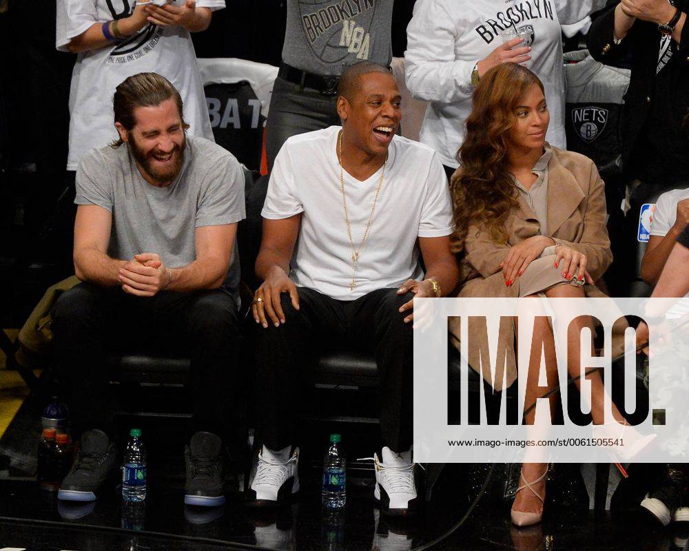Actor Jake Gyllenhaal, Rapper Jay Z and Beyonce share a laugh in the fourth quarter in Game 3 of the Eastern Conference Semifinals at Barclays Center in New York City on May 10, 2014. The Nets defeated the Heat 104-90 for a 2-1 Miami Heat series lead. NYP20140510125