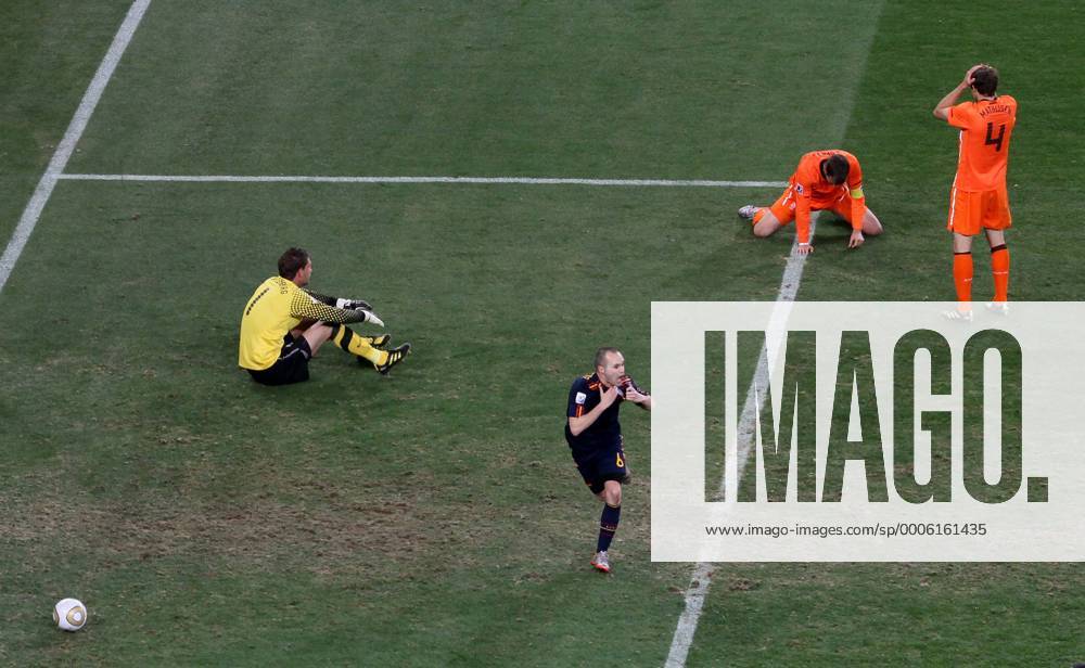 Spain s Andres Iniesta (C) celebrates scoring his sides winning goal against goalkeeper Maarten Stekelenburg (L), Rafael van der Vaart (2nd R) and Joris Mathijsen (R) of Netherlands FIFA World Cup 2010 Final Netherlands v Spain 11th July, 2010 . o0 Jubel, Freude