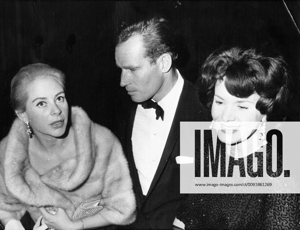 Dec. 9, 1961 - Paris, France - Actor CHARLTON HESTON known for his religious roles in Ben-Hur and The Ten Commandments , pictured with his wife LYDIA CLARKE and GENEVIEVE PAGE at the premiere of El Cid . Paris France - ZUMAk09