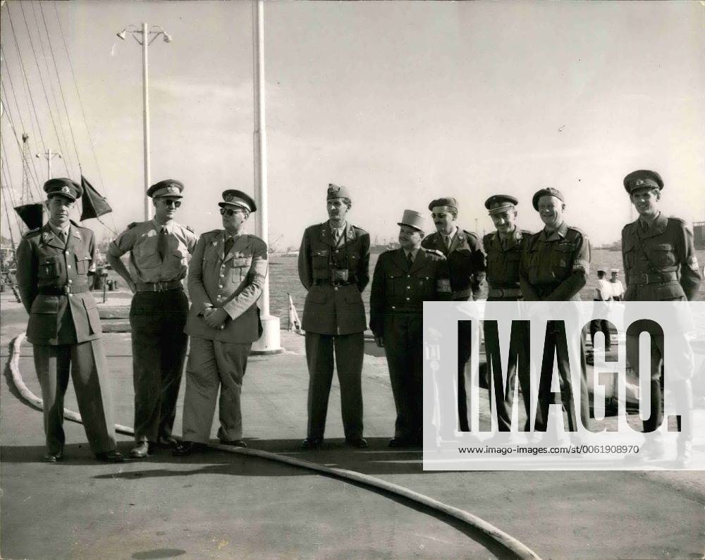Nov. 11, 1956 - U.N. Observers arrive in Port Said.: Picture received in London today from Port Said. The United Nations is observes from any U.N. countries arrived in Port Said by landing craft. They had come to observe the Cease Fire agreement between Anglo-French and Egyptian forces. Photo shows afters they had arrived in Port Said they drove to the Allied Headquarters at Suez House. There they met The Task Force Commander General Sir Hugh Stockwell. Hore are a group of the observes at Suez House with the Canal in the background. - ZUMAk09