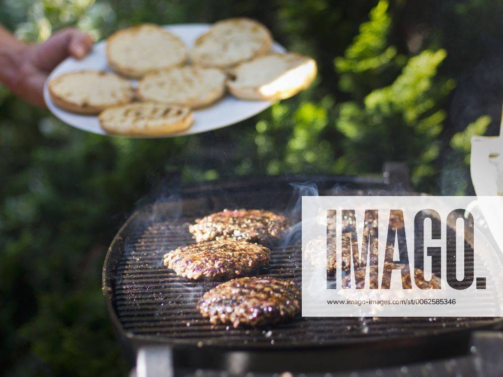 Food, Fast Food, Burger Germany, Munich, Mature man frying ground beef model released SBHF000031