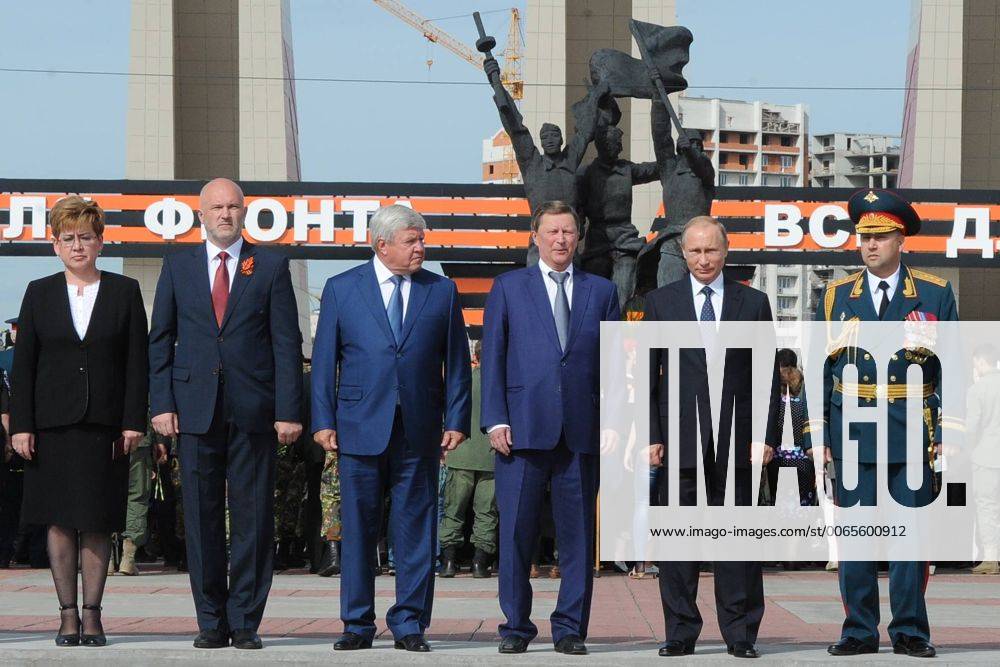 CHITA, RUSSIA. SEPTEMBER 2, 2015. Russia s President Vladimir Putin (2nd R), Transbaikal Territory Governor Konstantin Ilkovsky (2nd L) and Kremlin s Chief of Staff Sergei Ivanov (3rd R) pose for a photograph during a wreath laying ceremony at the WWII Memorial in Chita on the day of the 70th anniversary of the End of World War II. The monument was opened on May 9, 1975, in memory of the Transbaikal Territory residents killed in WWII. Mikhail Klimentyev Russian Presidential Press and Information Office TASS TS00C3E1