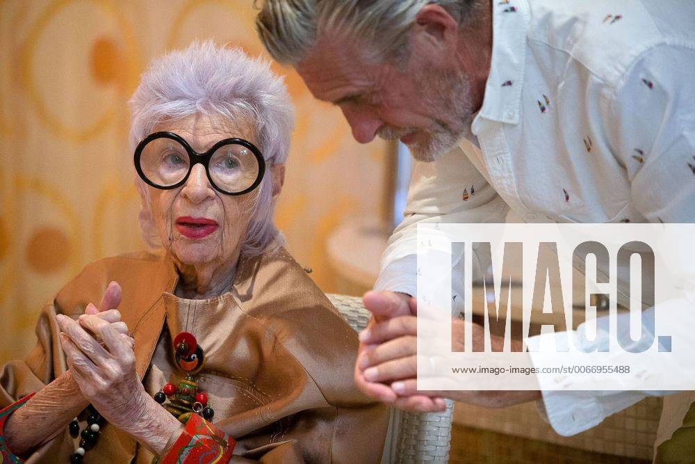 IMAGO ICONS: Iris Apfel Aug. 19, 2014 - Manalapan, Florida, U.S. - Fashion icon and former interior designer Iris Apfel, 93, left, and model Bernard Fouquet, right, pose during a video shoot for a new advertising campaign at Eau Spa Palm Beach on Tuesday, August 19, 2014 in Manalapan. - ZUMAp77