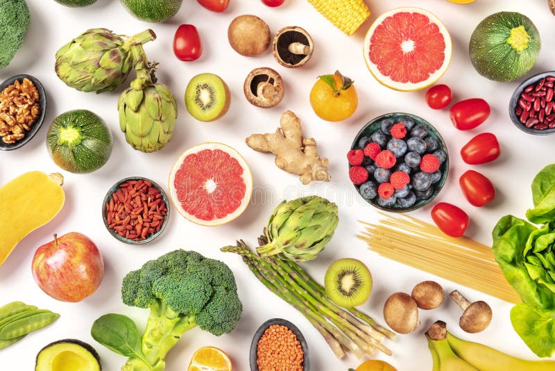 Vegan food. Healthy diet concept. Fruits, vegetables, pasta, nuts, legumes, mushrooms, shot from the top, Vegan food. Healthy diet concept. Fruits, vegetables, pasta, nuts, legumes, mushrooms, shot from the top on a white background. A flat lay composition