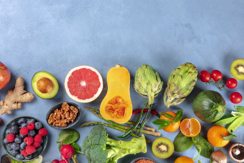 Vegan food. Healthy diet concept. Fruits, vegetables, nuts, mushrooms, Vegan food. Healthy diet concept. Fruits, vegetables, nuts, mushrooms, shot from the top. A flat lay composition with a place for text