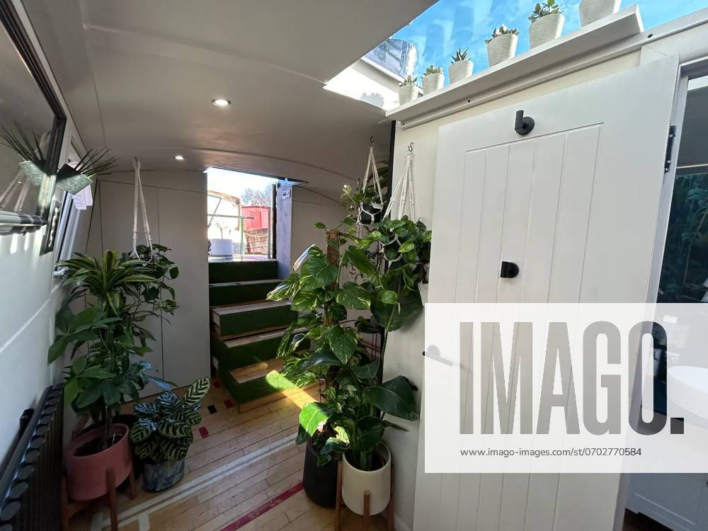 Love plants? Stay in Londons first live-in terrarium boat this summer Story from Jam Press (Terrarium Boat) Pictured: The entrance to The Floating Terrarium. Love plants? Stay in Londons first live-in terrarium boat this summer Are you a plant lover? A water babe? Well, now you can take both to the next level with a stay on a ˜terrarium boat . Moored on a canal in Hackney, London, this life-size ecosystem is made for those who want to get close to nature. The 48.3 sq m boat is decked out with 150 verdant houseplants - making it a perfect live-in oasis. Terrariums are more commonly known to be small, sometimes big, glass enclosures filled with plants, stones and mosses. But this one is a floating, green sanctuary. The t