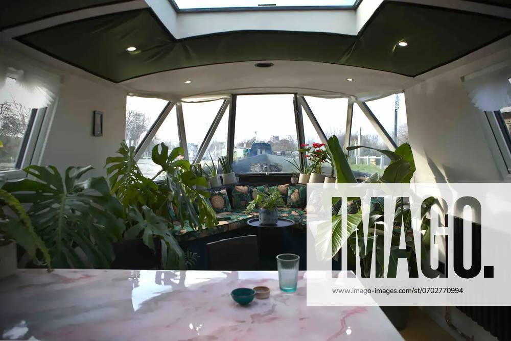 Love plants? Stay in Londons first live-in terrarium boat this summer Story from Jam Press (Terrarium Boat) Pictured: The dining area. Love plants? Stay in Londons first live-in terrarium boat this summer Are you a plant lover? A water babe? Well, now you can take both to the next level with a stay on a ˜terrarium boat . Moored on a canal in Hackney, London, this life-size ecosystem is made for those who want to get close to nature. The 48.3 sq m boat is decked out with 150 verdant houseplants - making it a perfect live-in oasis. Terrariums are more commonly known to be small, sometimes big, glass enclosures filled with plants, stones and mosses. But this one is a floating, green sanctuary. The two-guest property is co