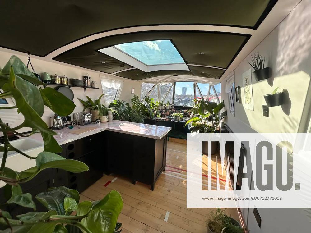Love plants? Stay in Londons first live-in terrarium boat this summer Story from Jam Press (Terrarium Boat) Pictured: The kitchen. Love plants? Stay in Londons first live-in terrarium boat this summer Are you a plant lover? A water babe? Well, now you can take both to the next level with a stay on a ˜terrarium boat . Moored on a canal in Hackney, London, this life-size ecosystem is made for those who want to get close to nature. The 48.3 sq m boat is decked out with 150 verdant houseplants - making it a perfect live-in oasis. Terrariums are more commonly known to be small, sometimes big, glass enclosures filled with plants, stones and mosses. But this one is a floating, green sanctuary. The two-guest property is comple