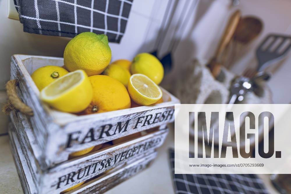 Kitchen Interior. Selective Focus on a Box with Fresh Ripe Lemons. Tasty Citrus Fruits for Lemonade. Home Life. Healthy Organic Nutrition.. Ripe Fresh Lemons on Kitchen ,model released, Symbolfoto