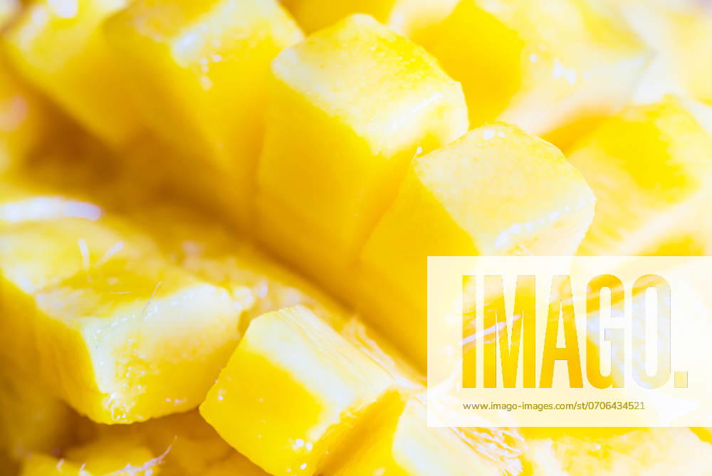 Close up view of ripe mango fruit sliced into cubes. Soft focus, can be used as food background ,model released, Symbolfoto