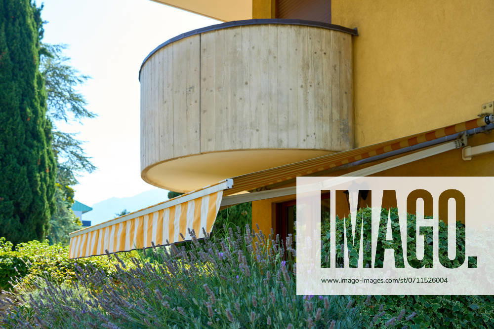 Nago-Torbole, Lake Garda, Italy - 15 July 2024: Awning on a vacation apartment on Lake Garda offers optimum sun protection and increases outdoor living comfort. Awning provides pleasant shade and a cozy ambience on the terrace in Italy