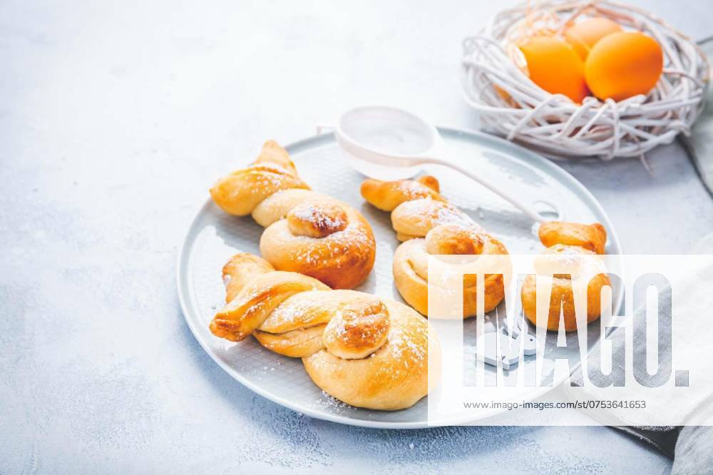 Buns made from yeast dough in a shape of Easter bunny and colored eggs, Buns made from yeast dough in a shape of Easter bunny and colored eggs, Buns made from yeast dough in a shape of Easter bunny and colored eggs, 20.02.2024,