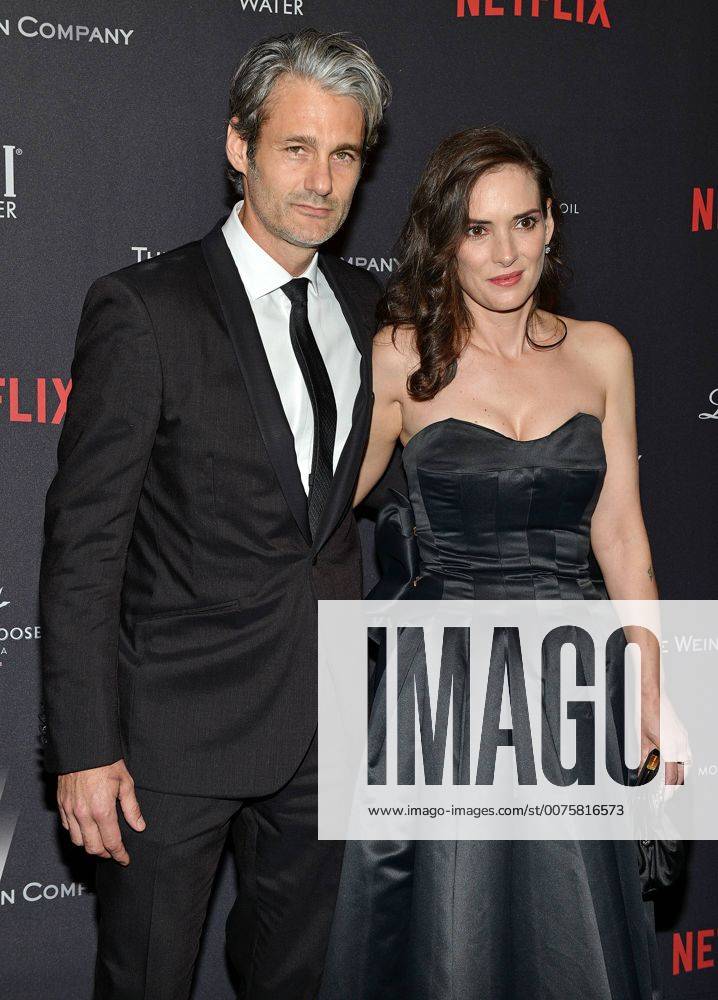 Winona Ryder (R) and Scott Mackinlay Hahn arrive at the Weinstein Company and Netflix 2017 Golden Globes after party at the Beverly Hilton in Beverly Hills, California on January 8, 2017. LAP201701082036 CHRISTINExCHEW