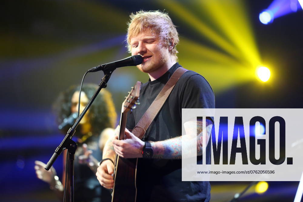 Ed Sheeran Live in Copenhagen. Photo. Ed Sheeran Edward Christopher Ed Sheeran (born 17 February 1991) is an English singer-songwriter and guitarist. He also writes and produces songs on his own and created his label, Paw Print Records. 2 Sheeran is recognized for doing pop music. He was born in Halifax, West Yorkshire. As a child, he lived in Framlingham, Suffolk. Sheeran is set to release his third studio album, Ëœ ( divide ), on 3 March 2017. He released the two singles Shape of You and Castle on the Hill in January 2017. Shape of You became his first number-one hit on the Billboard Hot 100 when it entered at the top of the chart. The song has reached number one in several countries around the world, and Castle on the Hill