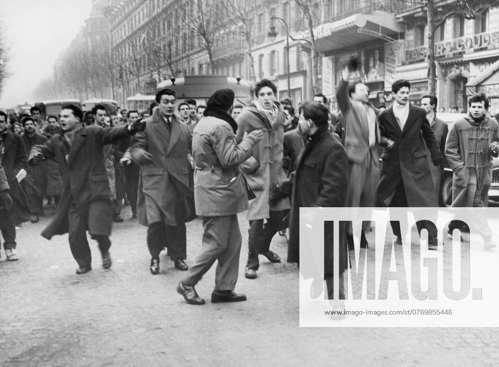 Orig. caption... WHEN RIGHT AND LEFT MEET. In Paris yesterday there was a clash between two groups of students in the Latin Quarter. Members of the new union of french students from Algeria, after laying a wreath on the war memorial, marched along the Boulevard St. Michel and clashed with another group of students coming from the Sorbonne, who greeted them with cries of Fascism will not pass! A short sharp struggle ensued, in which some blood flowed but little serious damage was done. Belts, clubs and fists were used. Five arrests made. Photo shows. The demonstrators in Rude Place de la Sorbonne, shouting their slogans, before clashing with the rival faction in Rue Victor Cousin. Note The Algerian Revolt - struggle 1954-1962 for liberation