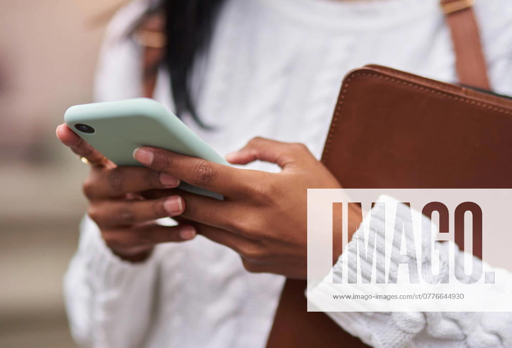 Outdoor, phone and hands of student, girl and research for studying, online and internet on app. Scholarship, university and person in campus with social media, reading news for school or college. model released property released