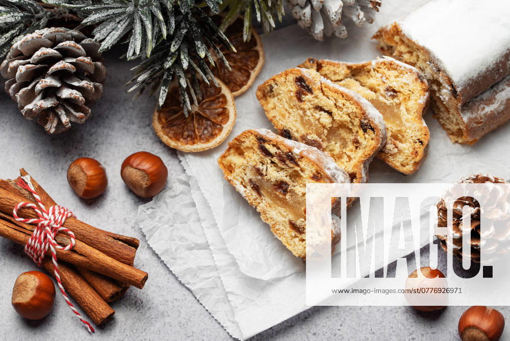 Traditional stollen fruit cake. Christmas stollen with winter holidays decoration Model Released OlenaRudo_ID24327_705163_029