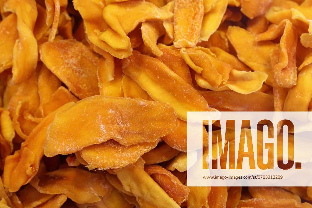 Dried mango slices forming a colorful and textured background, Close up view of dried mango slices showcasing vibrant color and intricate texture, creating an appealing visual for food and culinary themes, Close up view of dried mango slices showcasing vibrant color and intricate texture, creating an appealing visual for food and culinary themes, 17.11.2024,