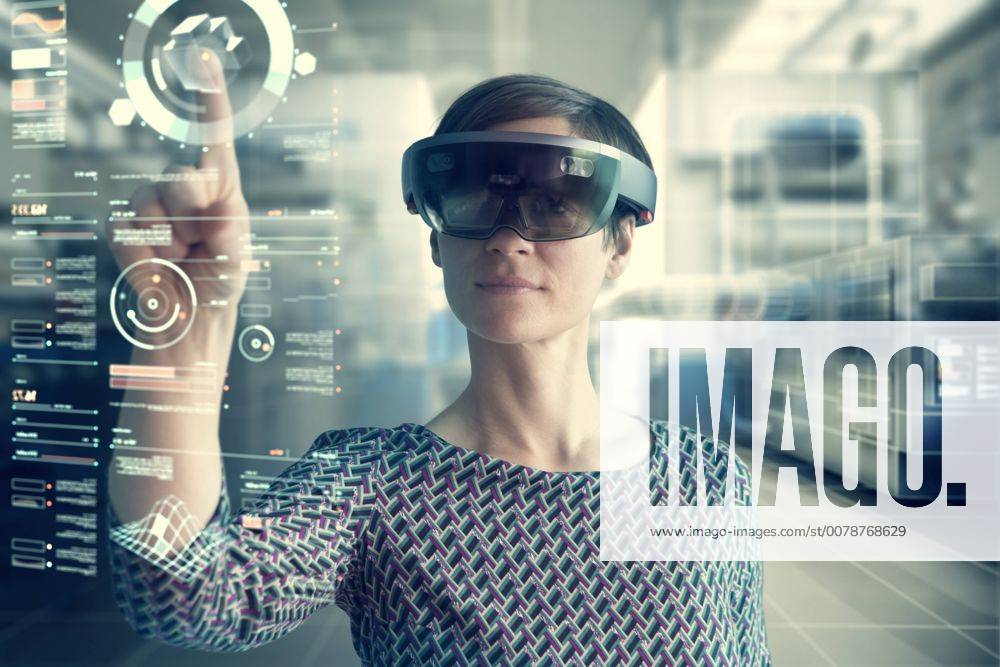 Woman wearing mixed reality smartglasses touching transparent screen model released Symbolfoto property released RBF05665