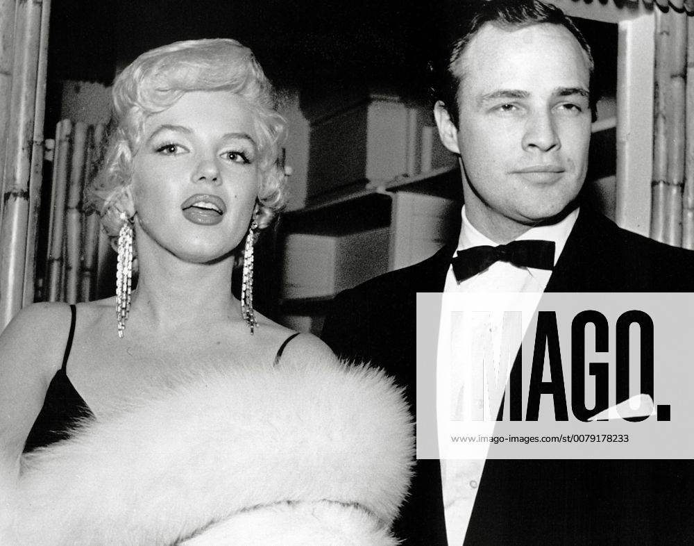 IMAGO ICONS: Marilyn Monroe (Archival Classic Cinema - Marilyn Monroe Retrospective) Marilyn Monroe and Marlon Brando attend the premiere for The Rose Tattoo, 1955 Cinema Publishers Collection Hollywood CA USA