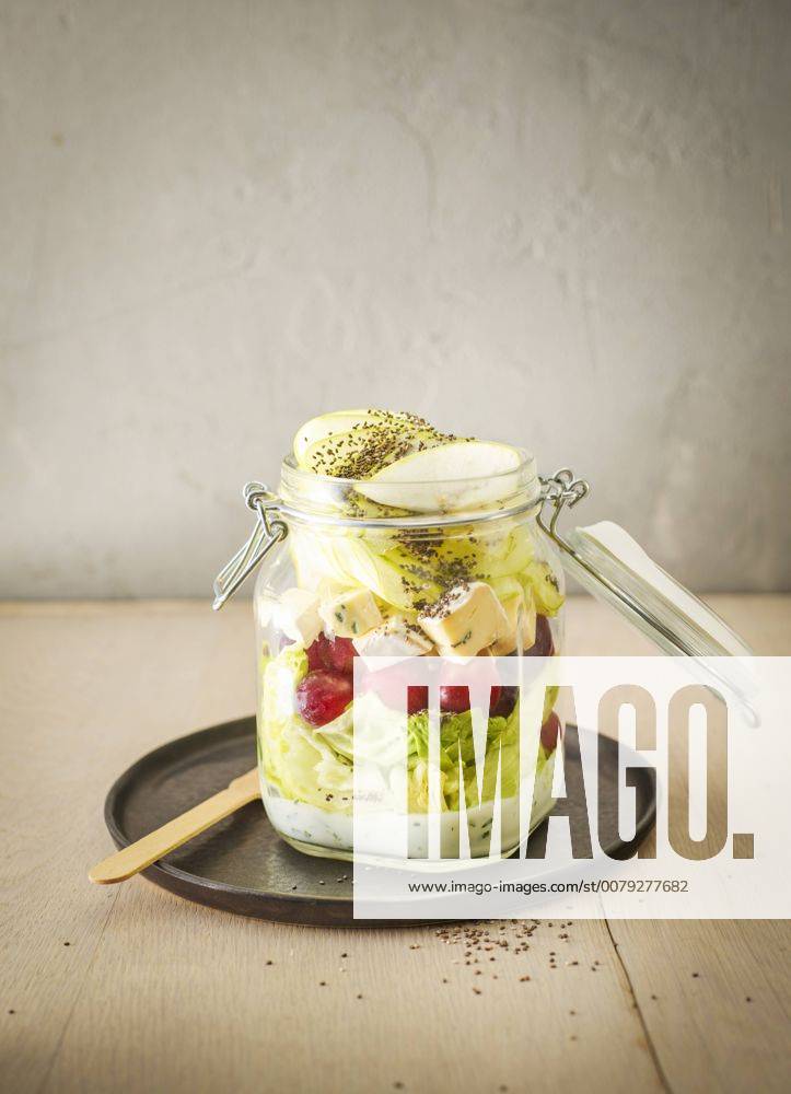Preserving jar of iceberg salad with grapes, apple, blue cheese and chia seeds KSWF01809